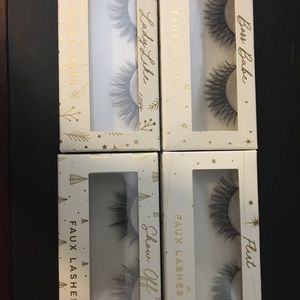 4 pair of false eyelashes. New in box Faux lashes